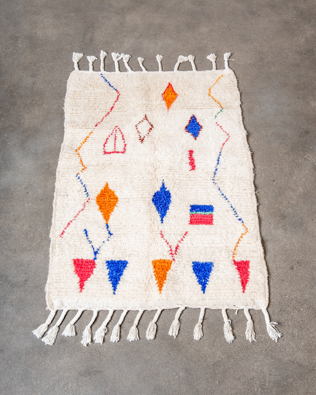 Modern, designer, handcrafted Berber rug from Morocco. Beniourain carpet with beautiful colours and patterns and fluffy wool texture.
